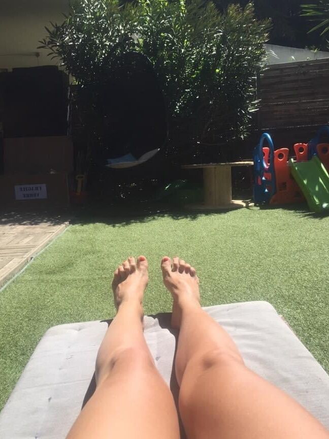 Legs and feet of a pretty reader