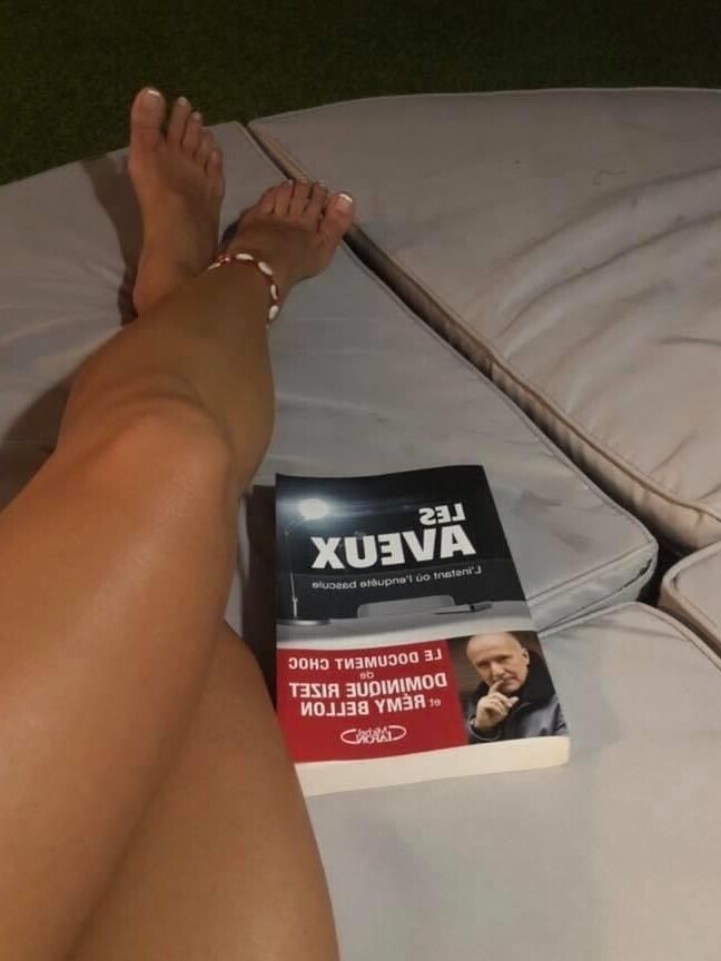 Legs and feet of a pretty reader