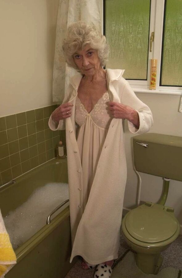 Central granny spreads old legs