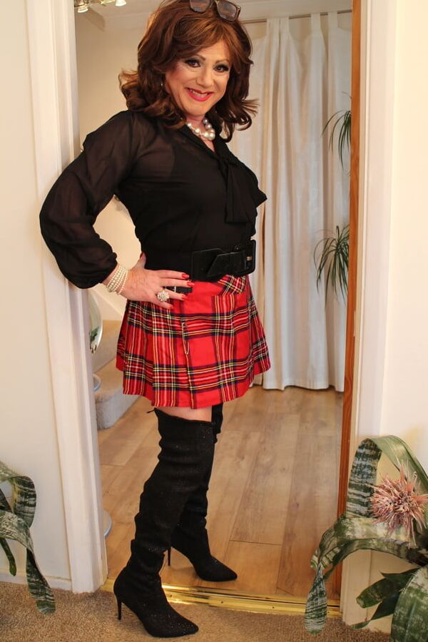 Black satin blouse and red mini kilt with OTK boots