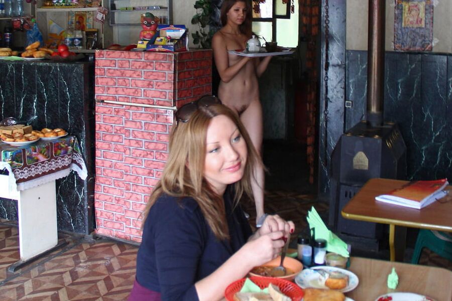 Young naked waitress at a roadside cafe