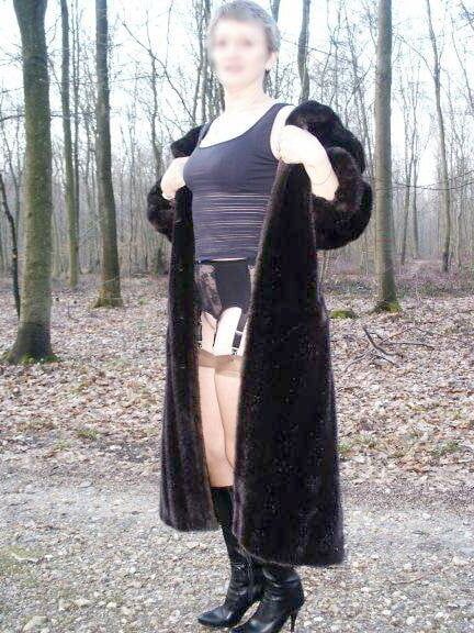 Mature in fur coat posing