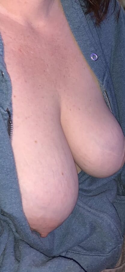 Big saggy tits. Unzipped and coming out.