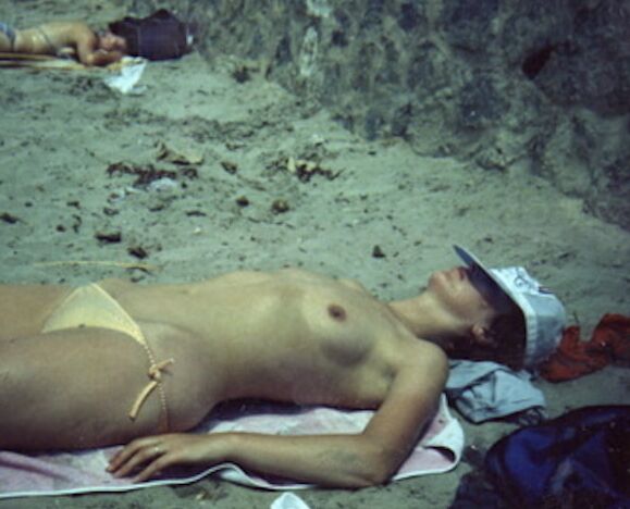 My wife on the beach over the years.