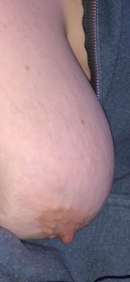 Big saggy tits. Unzipped and coming out.