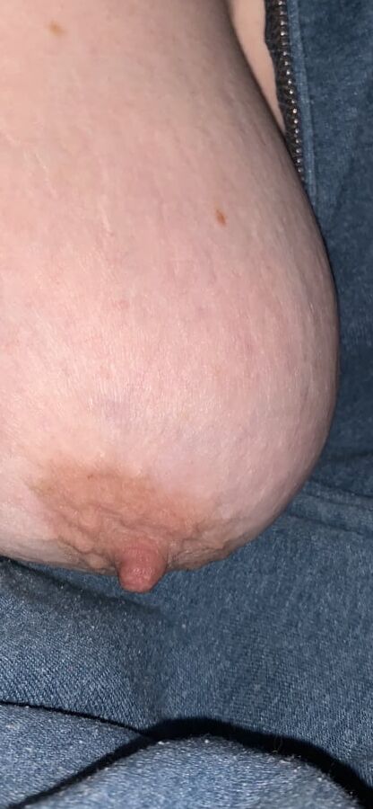 Big saggy tits. Unzipped and coming out.