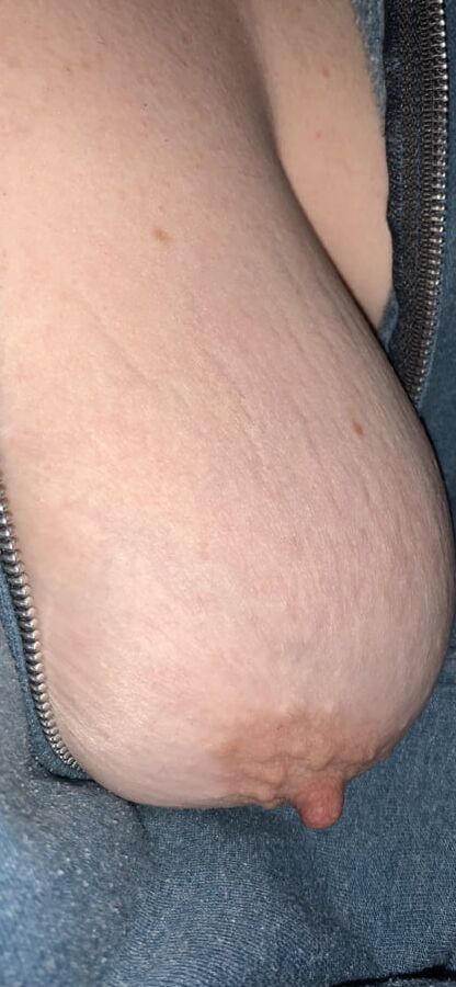 Big saggy tits. Unzipped and coming out.