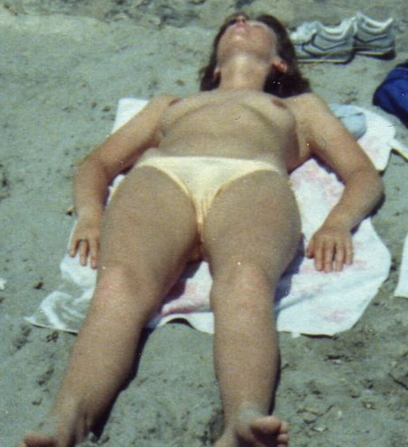 My wife on the beach over the years.