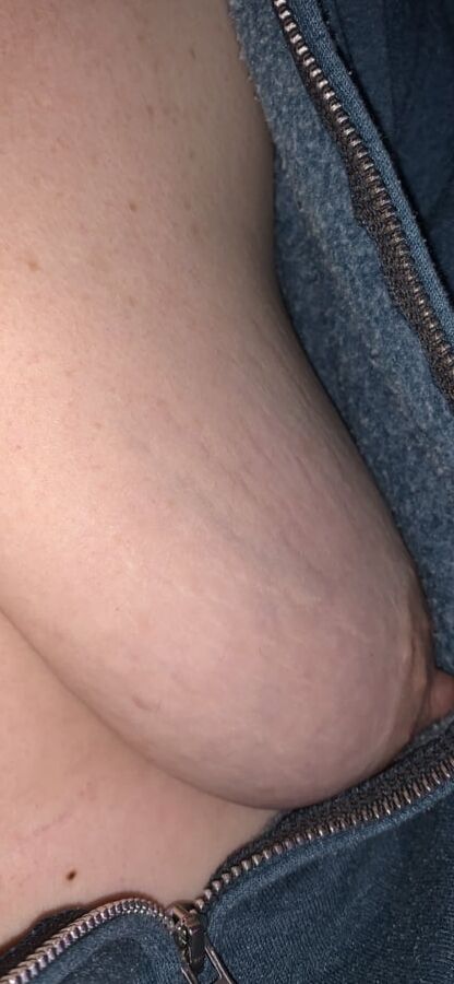 Big saggy tits. Unzipped and coming out.