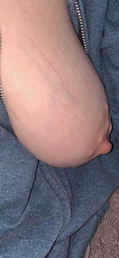 Big saggy tits. Unzipped and coming out.