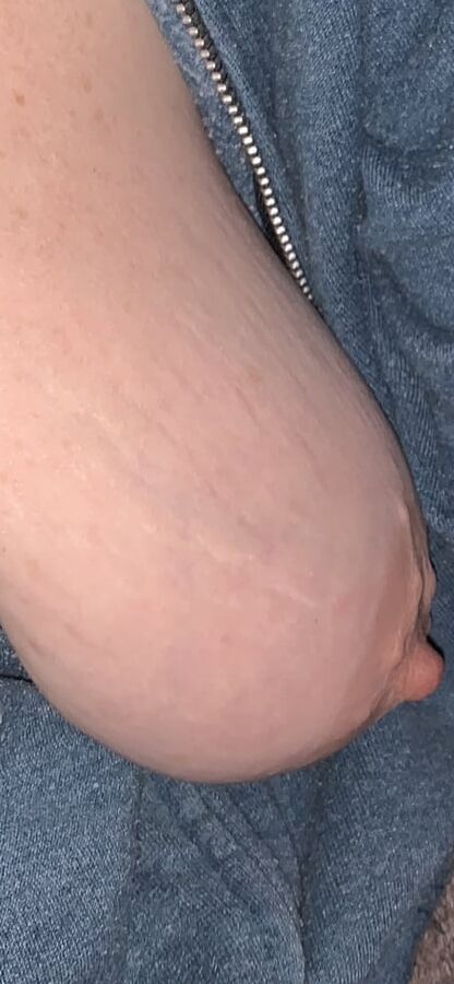 Big saggy tits. Unzipped and coming out.