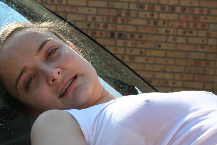 Slutty Davida getting wet and naked washing her car outside