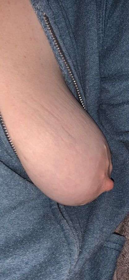 Big saggy tits. Unzipped and coming out.