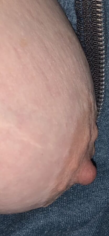 Big saggy tits. Unzipped and coming out.