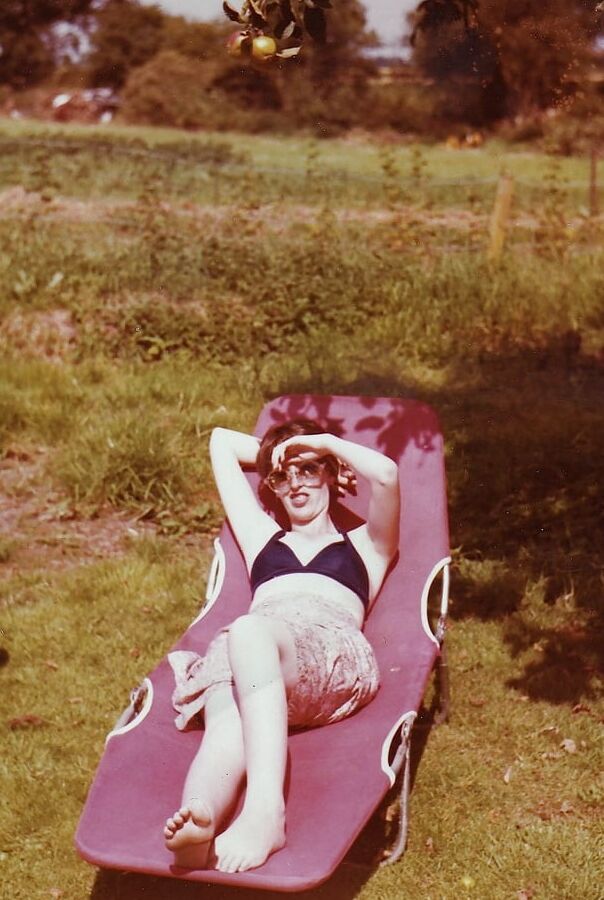 My wife on the beach over the years.