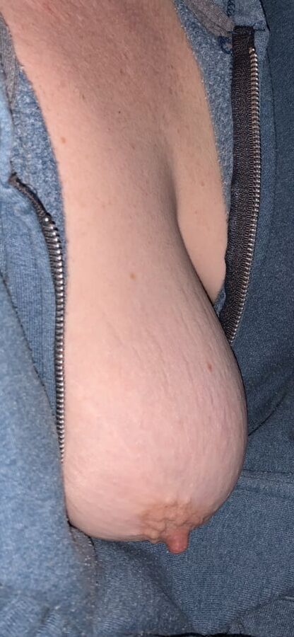 Big saggy tits. Unzipped and coming out.