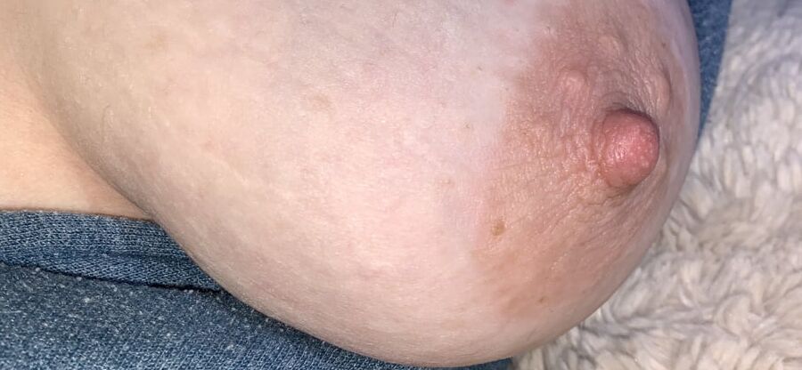 Big saggy tits. Unzipped and coming out.