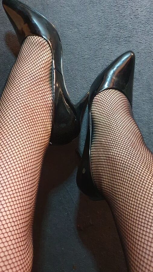 Fishnets and black patent heels