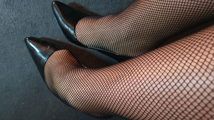 Fishnets and black patent heels