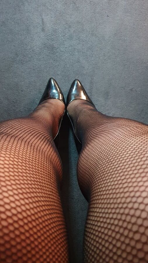 Fishnets and black patent heels