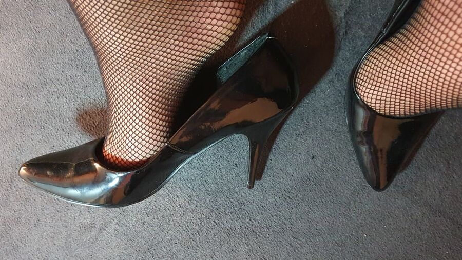 Fishnets and black patent heels