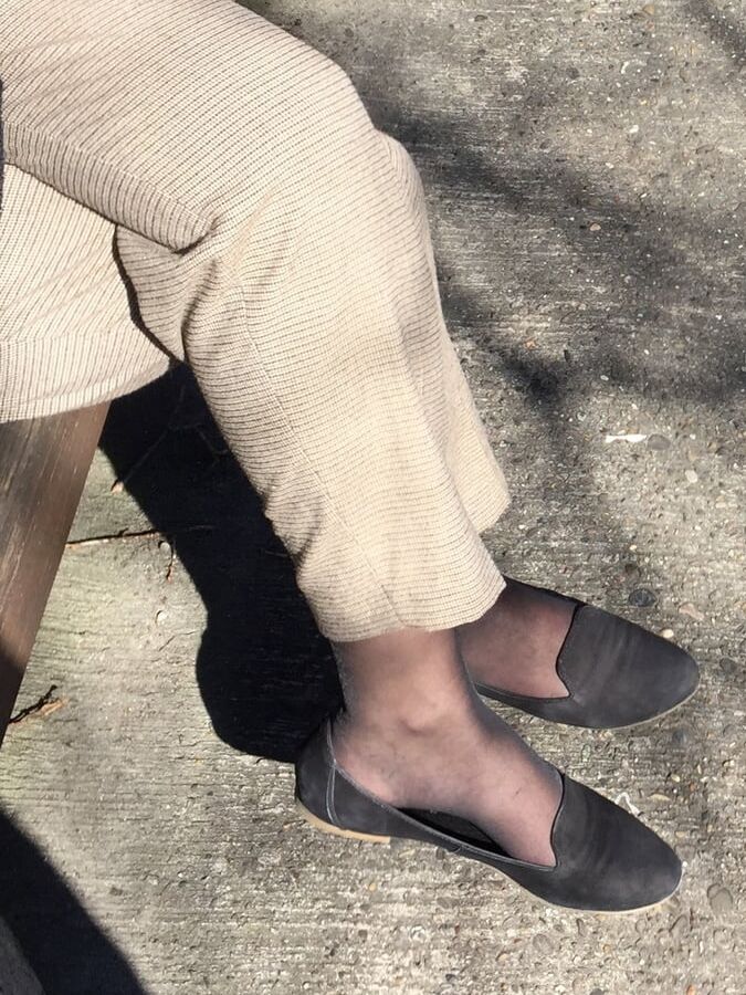 Girl showing some parts of her nice black hosed legs &amp; feet