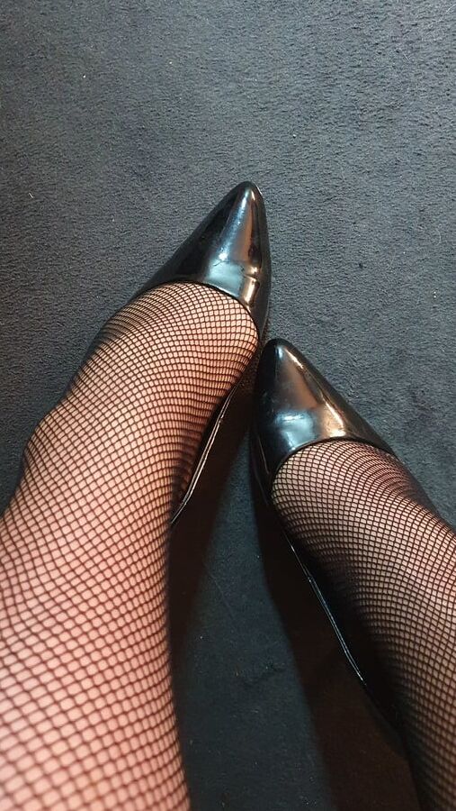 Fishnets and black patent heels