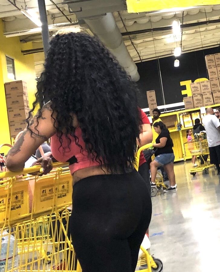 Black whore showing her ass