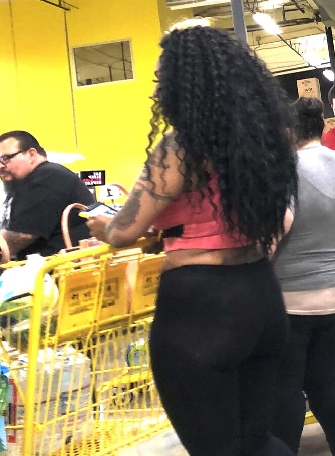 Black whore showing her ass
