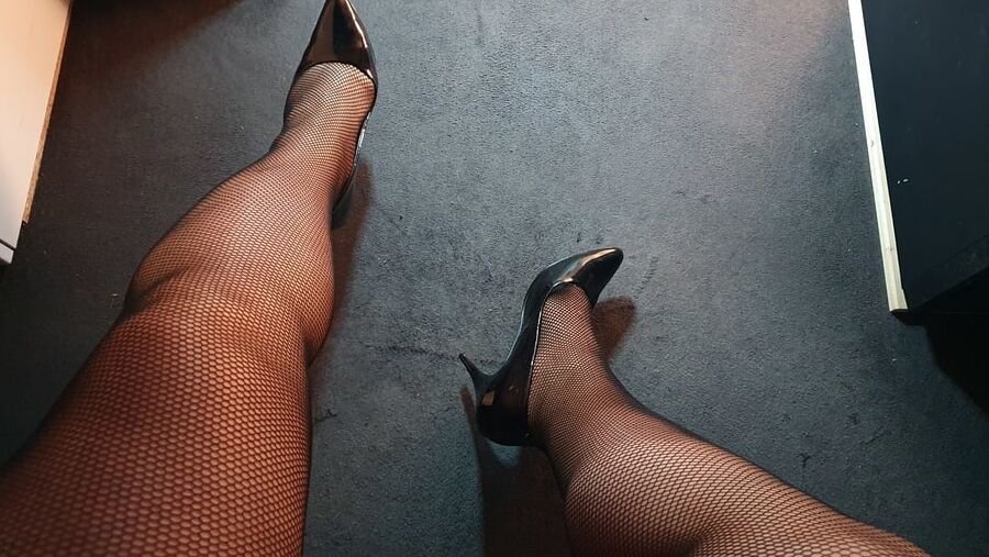 Fishnets and black patent heels