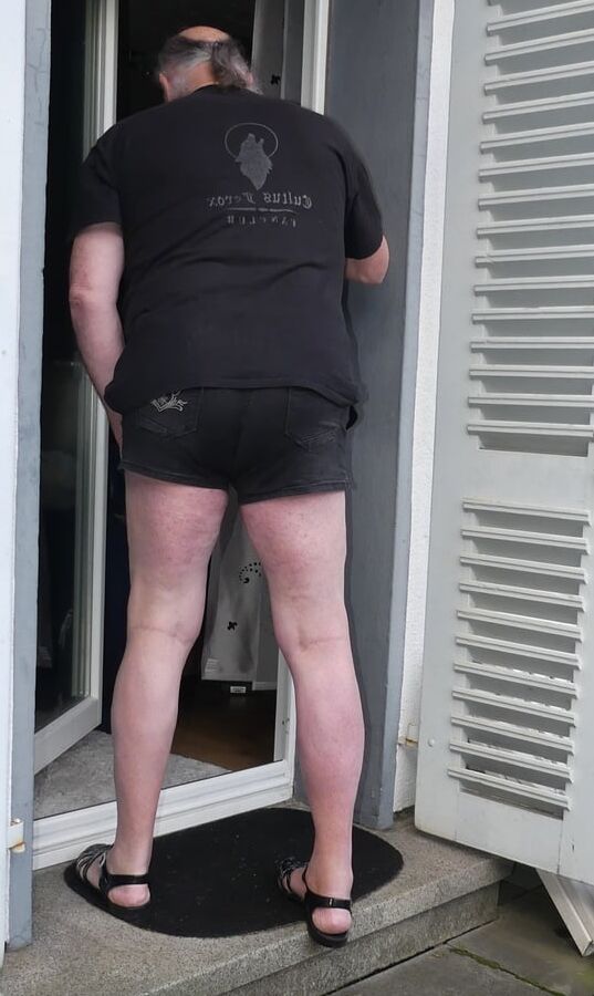 Traditional shorts barefoot in plastic sandals
