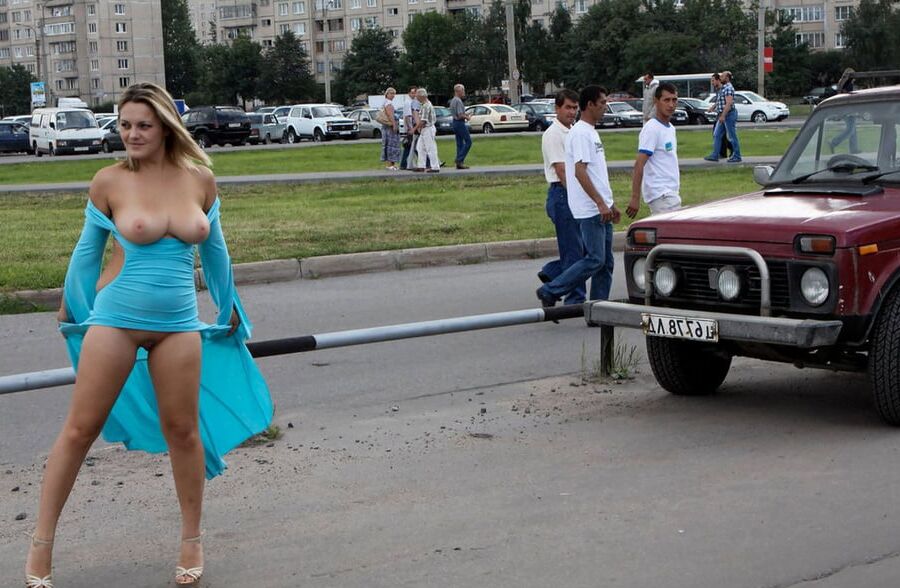 Smiling hot busty blonde private nude at public streets