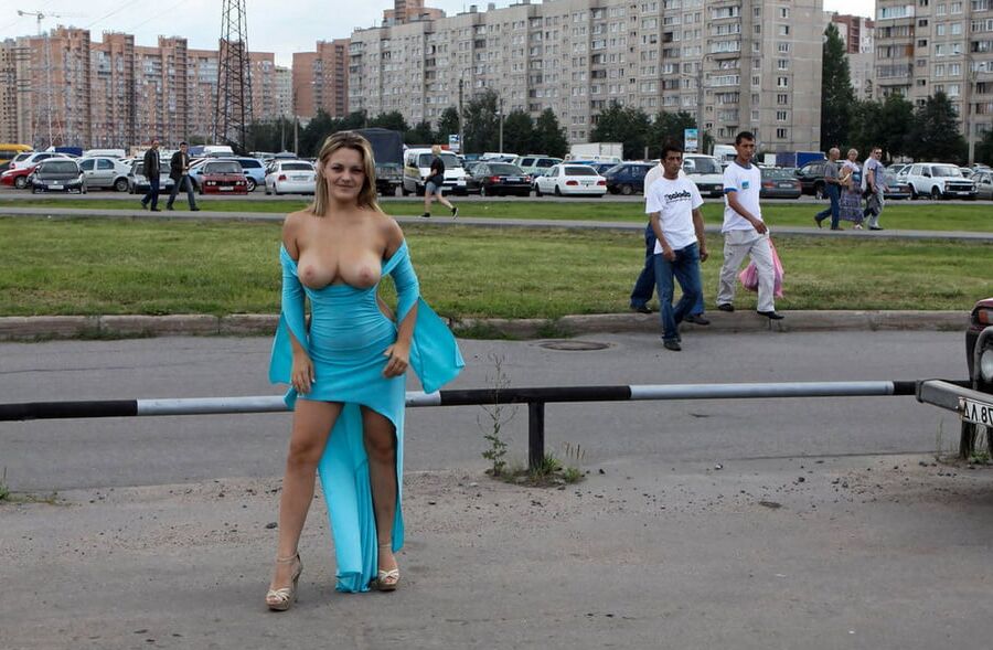 Smiling hot busty blonde private nude at public streets