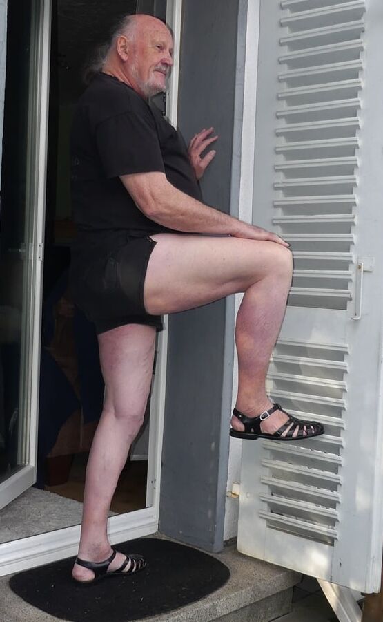 Traditional shorts barefoot in plastic sandals