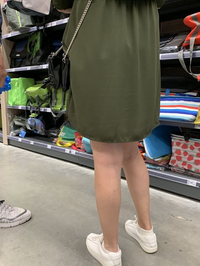 Upskirt lady in shop