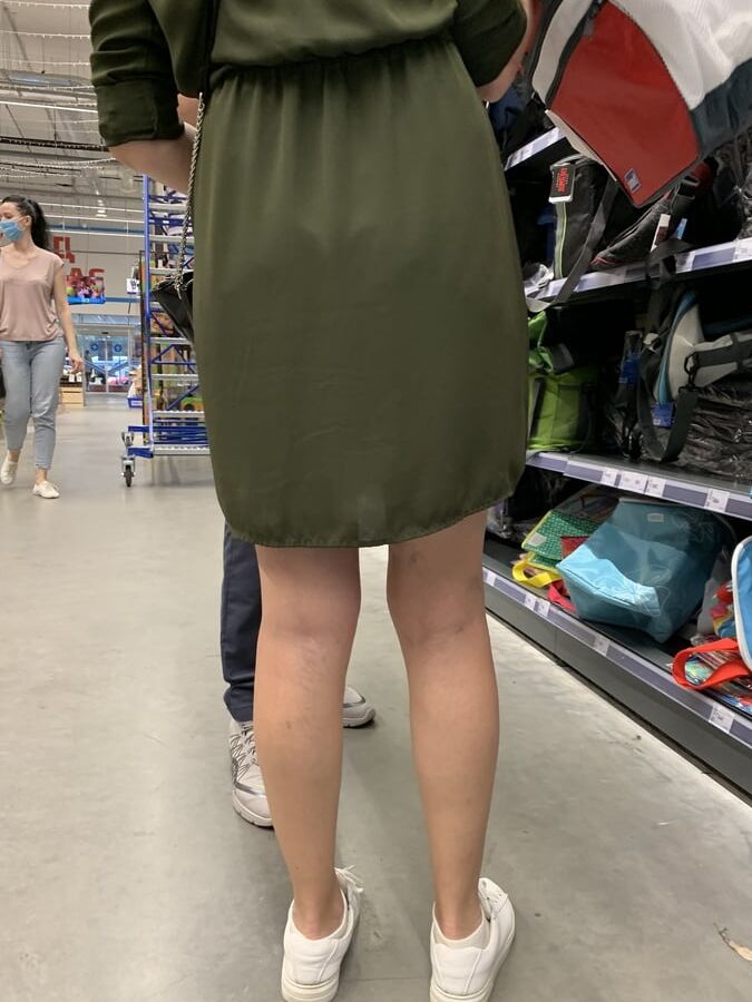 Upskirt lady in shop