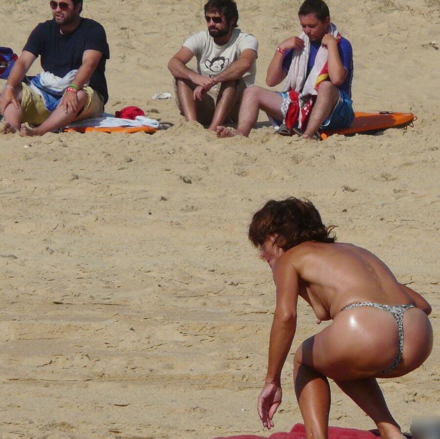 Hanging, saggy, floppy Nipples at beach