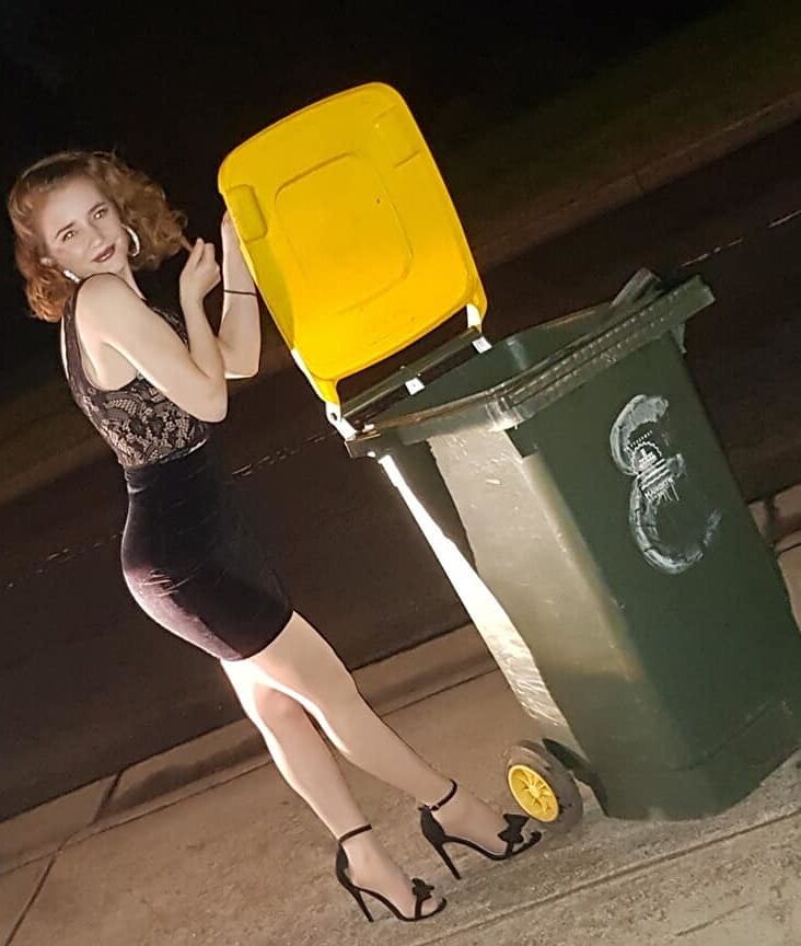 DRESSED UP TAKING TRASH OUT