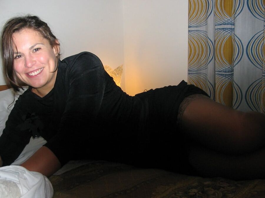 Cute amateur brunette wearing shiny stockings