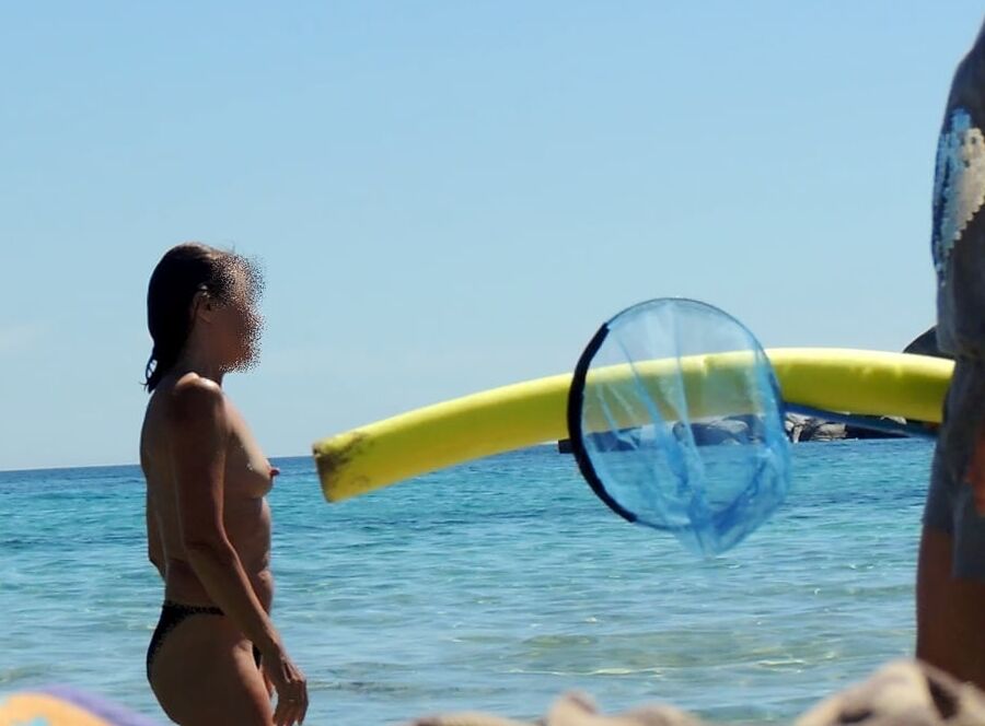 Hanging, saggy, floppy Nipples at beach