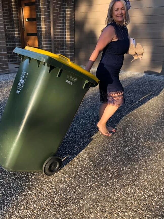 DRESSED UP TAKING TRASH OUT