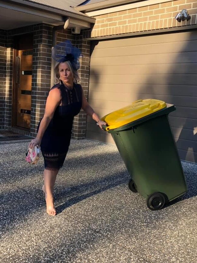 DRESSED UP TAKING TRASH OUT