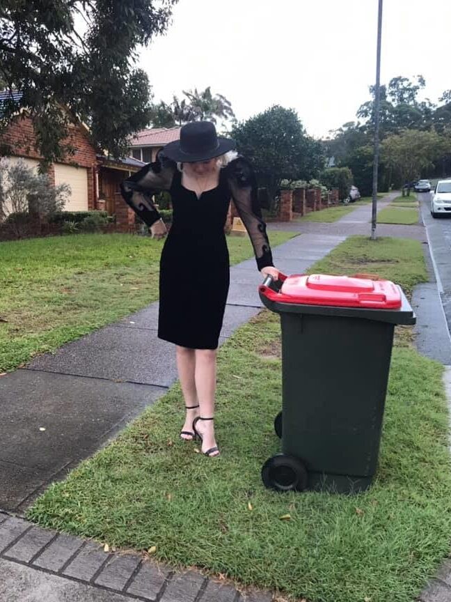DRESSED UP TAKING TRASH OUT
