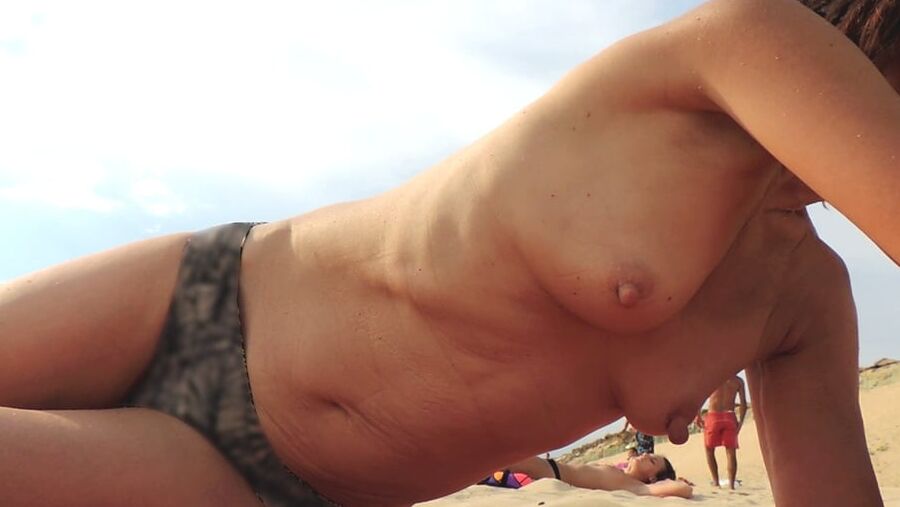 Hanging, saggy, floppy Nipples at beach