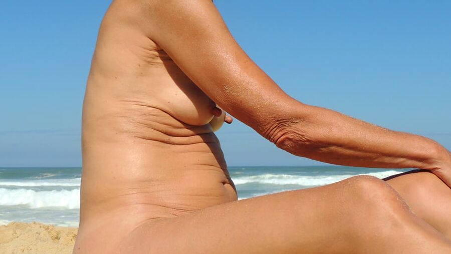 Hanging, saggy, floppy Nipples at beach