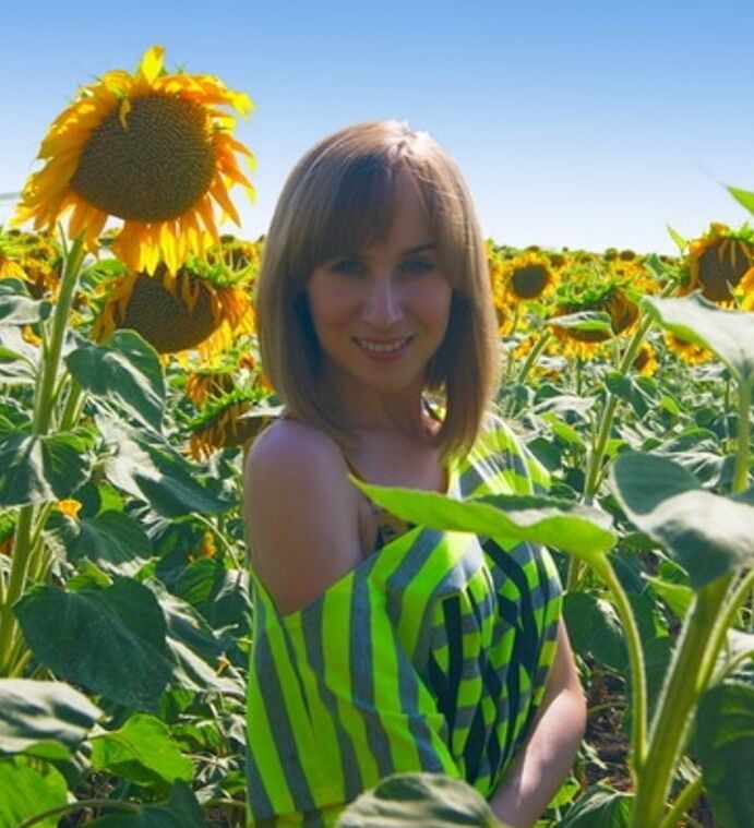 Woman and Sunflowers
