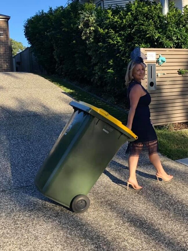 DRESSED UP TAKING TRASH OUT