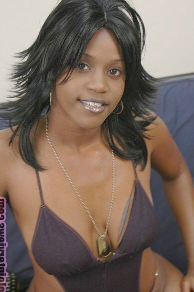 Black whore Coco Pink fucks herself with black dildos