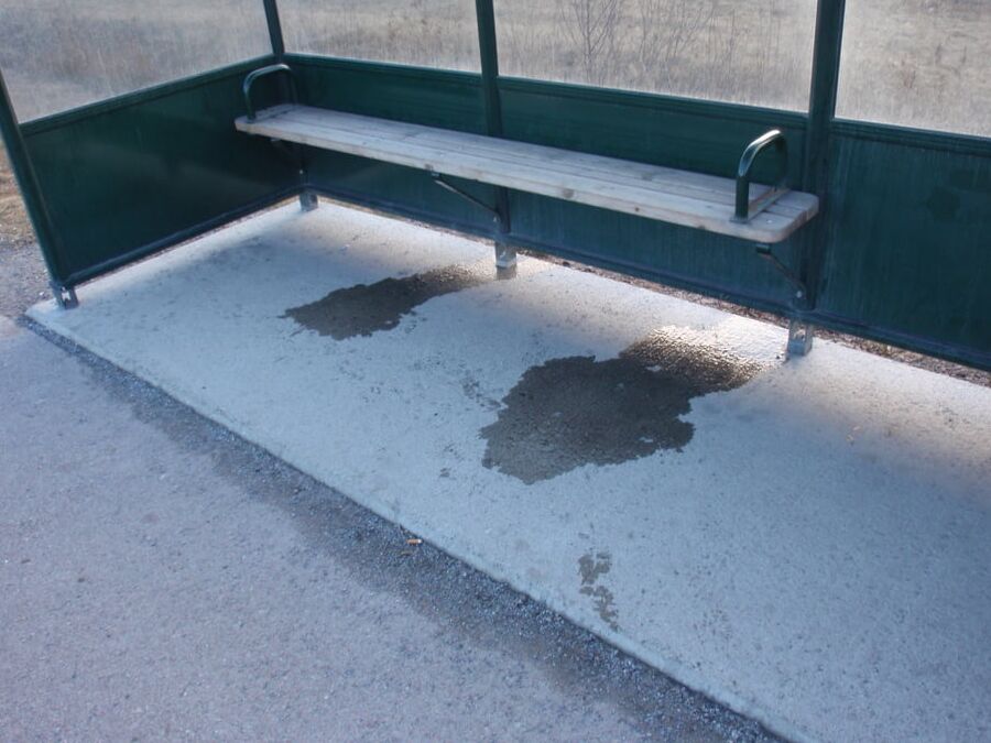 My piss puddles at the bus stop