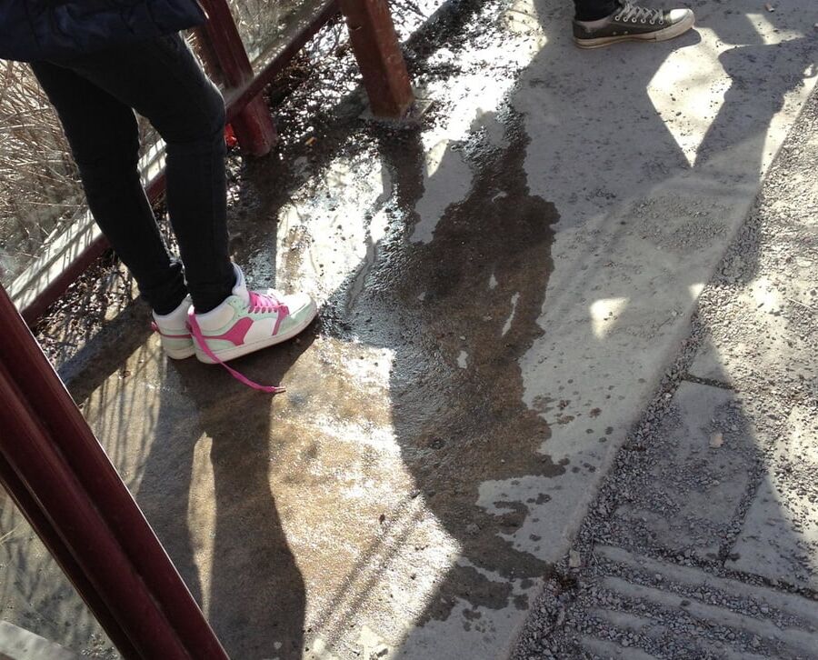 My piss puddles at the bus stop